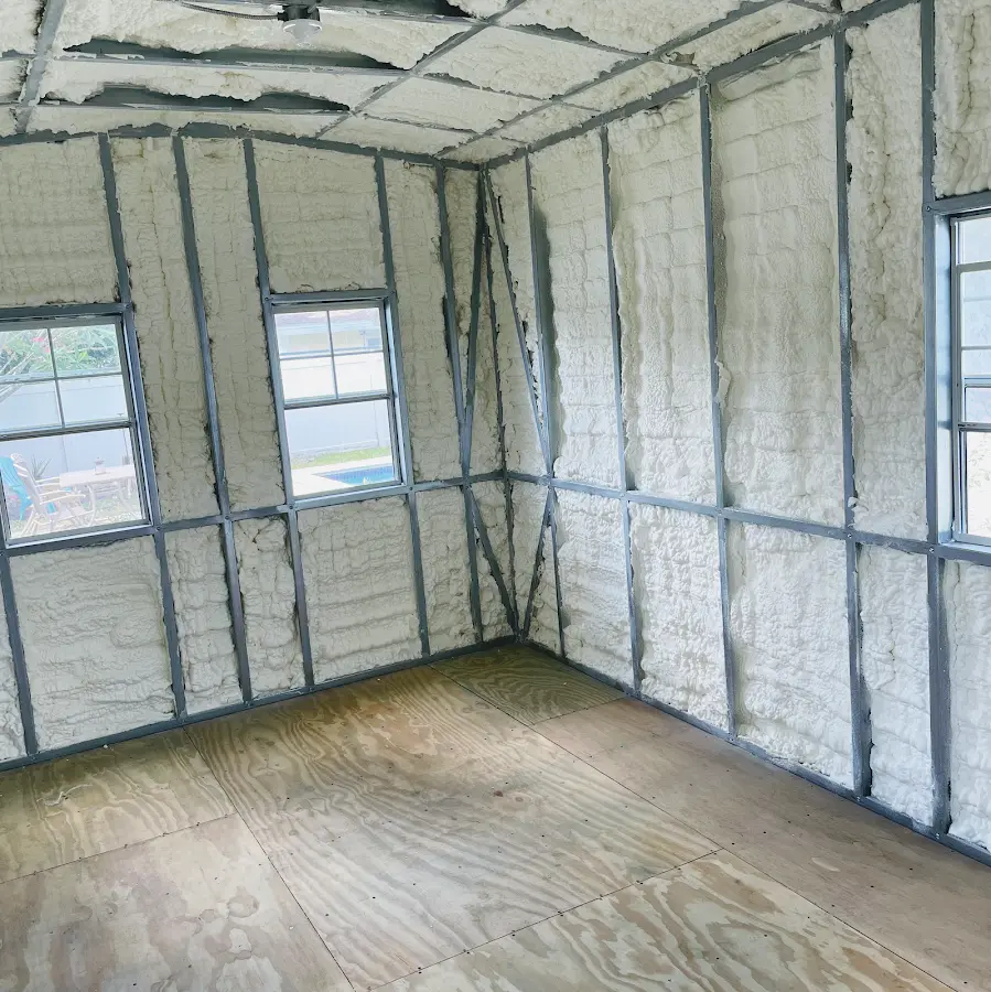 Closed-cell spray foam insulation applied to wall cavities in a residential project in Vernon